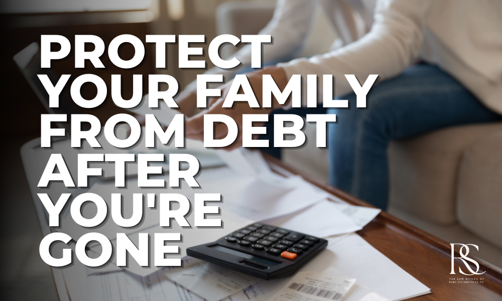 A person sits at a table surrounded by bills and financial documents with a calculator, representing the burden families face managing debt after a loved one's death — and why estate planning matters.